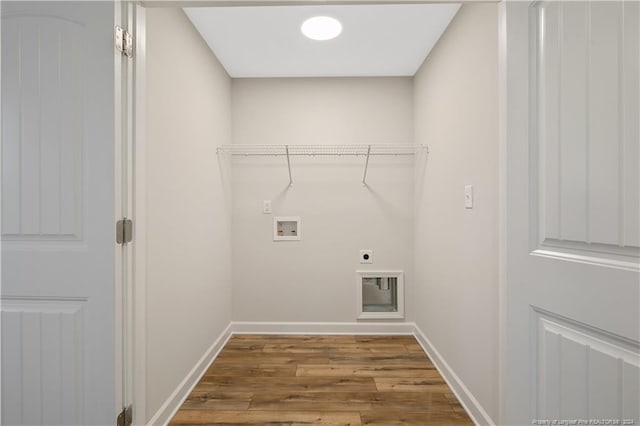 washroom with washer hookup, light hardwood / wood-style floors, and hookup for an electric dryer