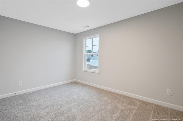 unfurnished room featuring carpet floors