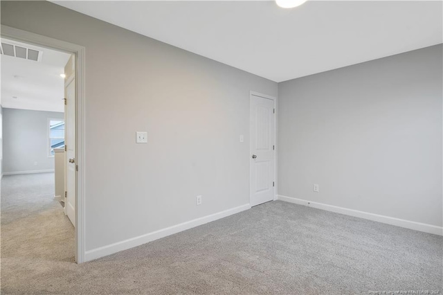 spare room with light carpet