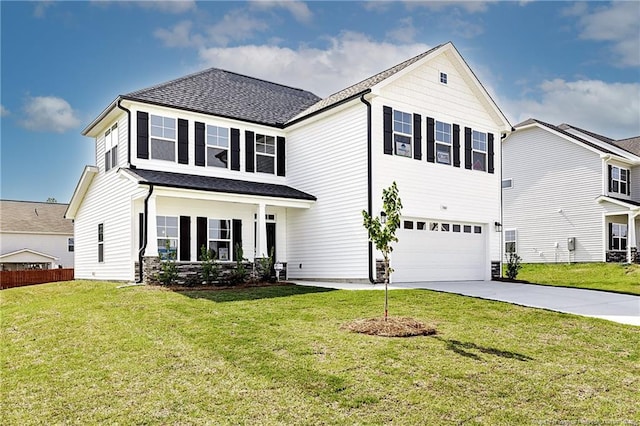  - traditional home with a garage, concrete driveway, and a shingled roof
