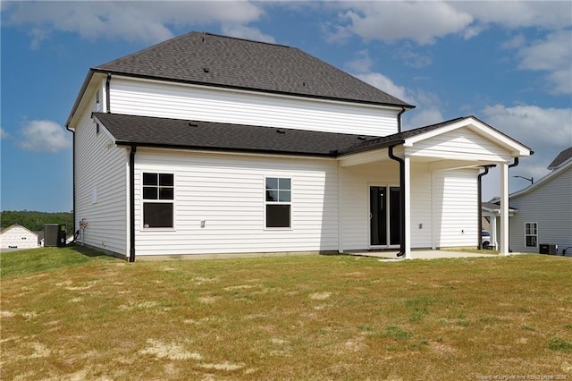  - rear view of property featuring central AC, a lawn, and a patio
