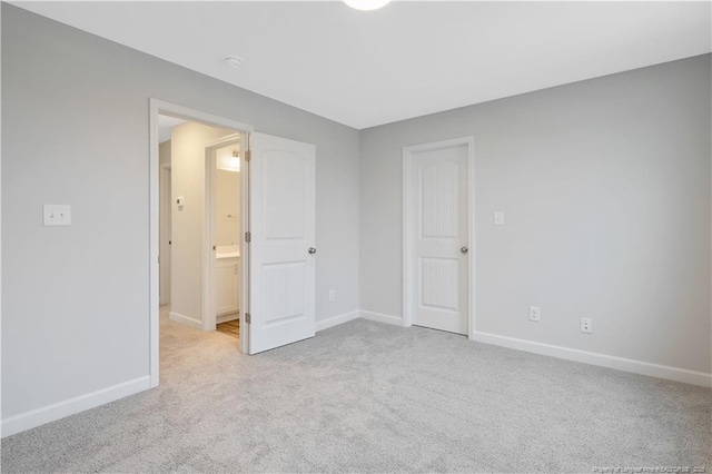  - carpeted spare room with baseboards