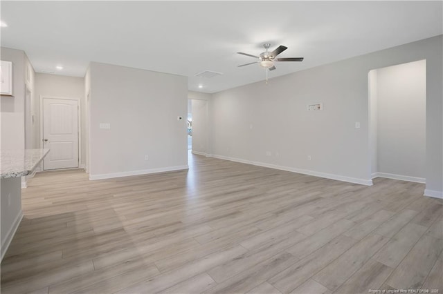 unfurnished living room with visible vents, baseboards, ceiling fan, light wood-style floors, and recessed lighting