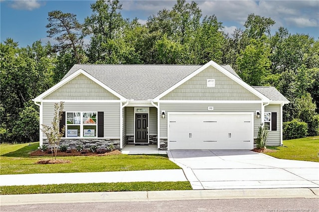 5513 Tall Timbers Dr, Fayetteville, NC 28311 - view of front facade with an attached garage, a front yard, driveway, stone siding, and view of scattered trees