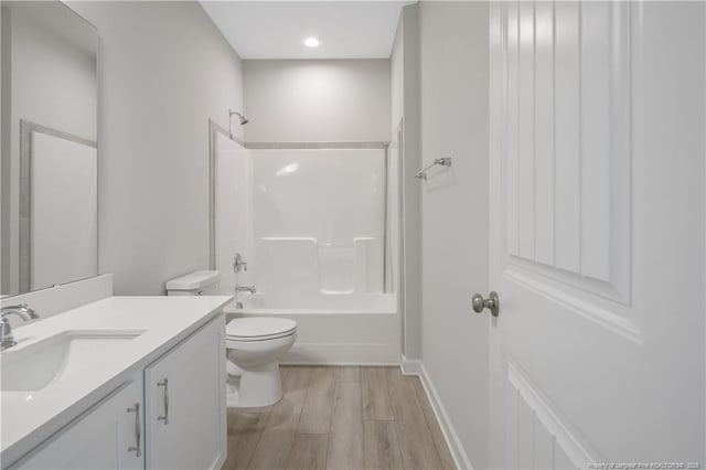 5513 Tall Timbers Dr, Fayetteville, NC 28311 - full bath featuring toilet, wood finished floors, vanity,  shower combination, and baseboards
