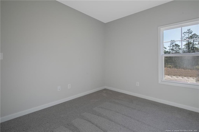 5513 Tall Timbers Dr, Fayetteville, NC 28311 - unfurnished room with baseboards and dark carpet