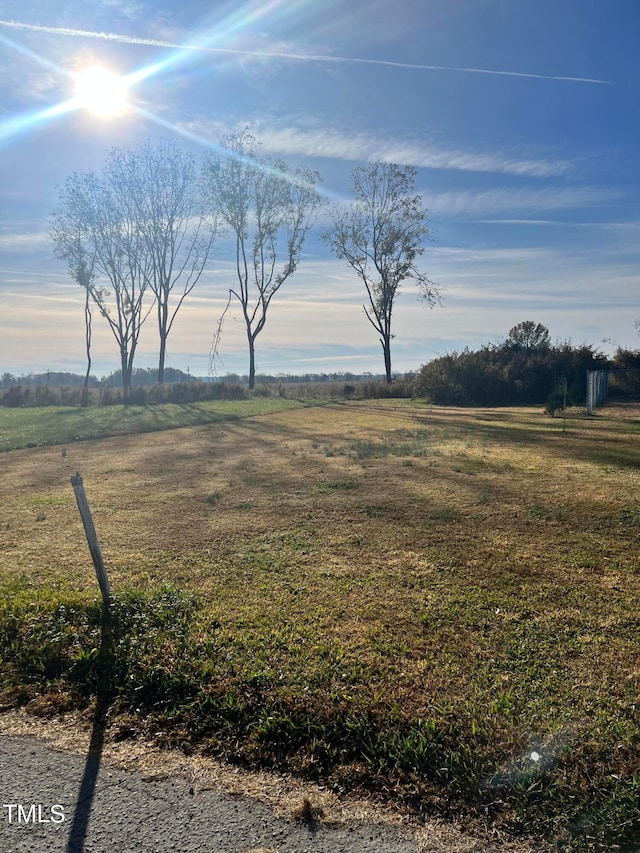 view of yard with a rural view