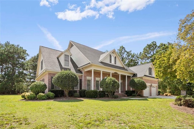 view of front facade with a front yard and a garage