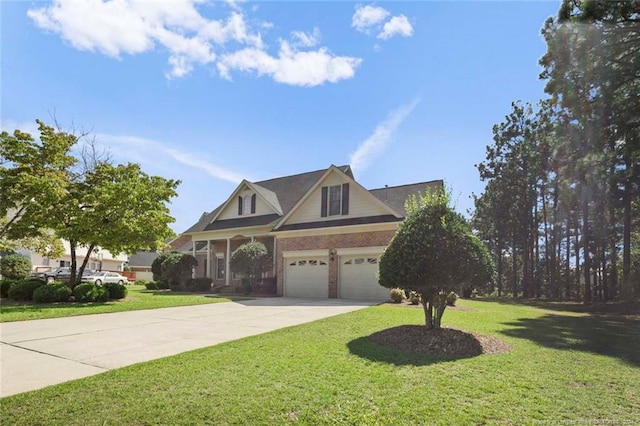 view of front of property featuring a front yard and a garage