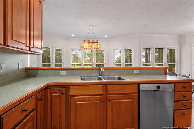 kitchen featuring dishwasher, sink, ornamental molding, a textured ceiling, and a chandelier