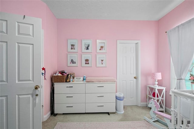 interior space featuring a textured ceiling and light colored carpet