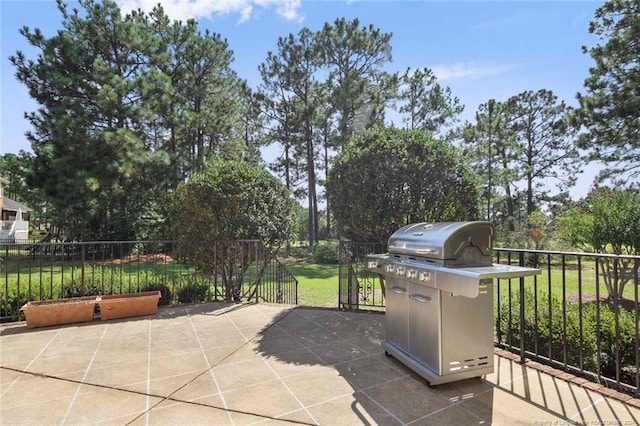 view of patio featuring a grill