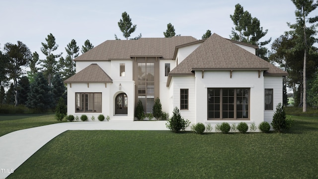 french country inspired facade featuring a front yard and roof with shingles