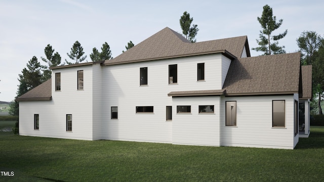 back of property with a yard and roof with shingles