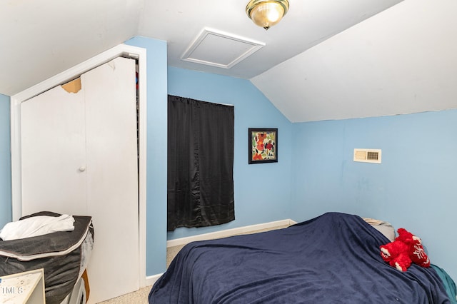 bedroom featuring carpet and lofted ceiling