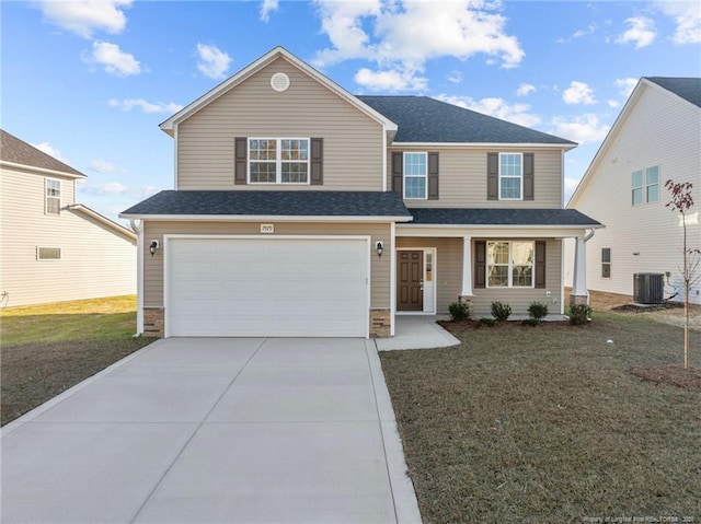 view of front of home with a front yard, a garage, and central AC unit