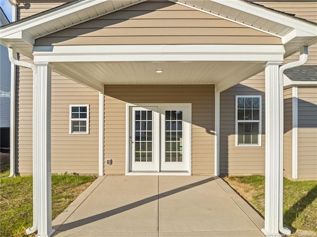 entrance to property with a patio area and french doors