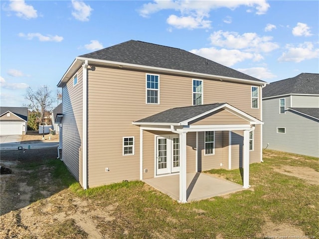 rear view of property with a patio area and a yard