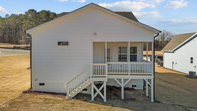 back of property with covered porch