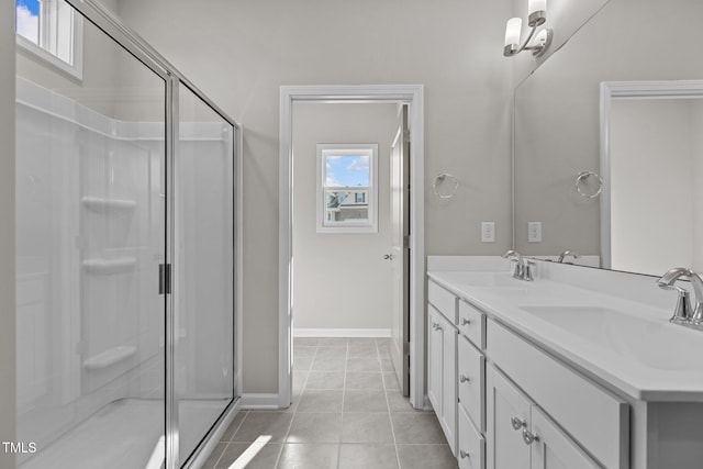 bathroom featuring vanity, tile patterned flooring, and an enclosed shower