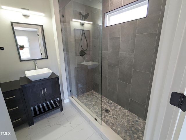 bathroom featuring walk in shower, tile patterned floors, and vanity