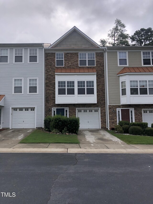 multi unit property featuring a garage