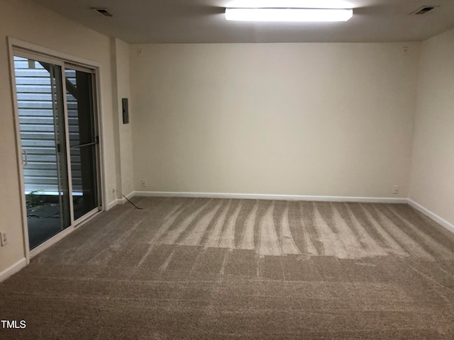 unfurnished room featuring carpet flooring