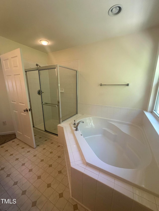 bathroom with independent shower and bath