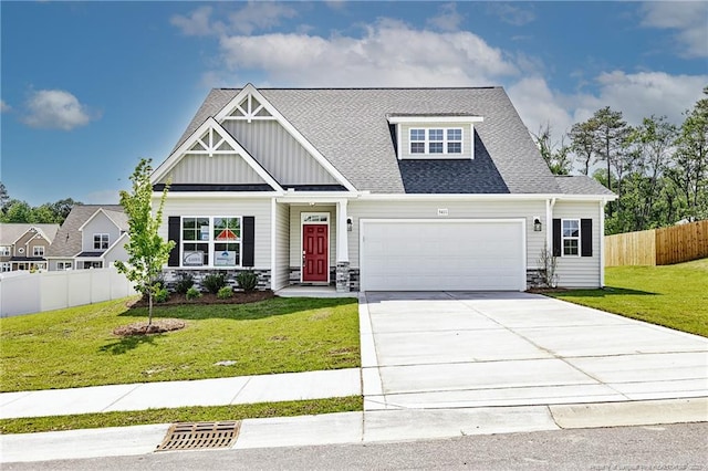 5411 Seedling Rd, Fayetteville, NC 28311 - view of front of house featuring board and batten siding, a garage, concrete driveway, roof with shingles, and stone siding