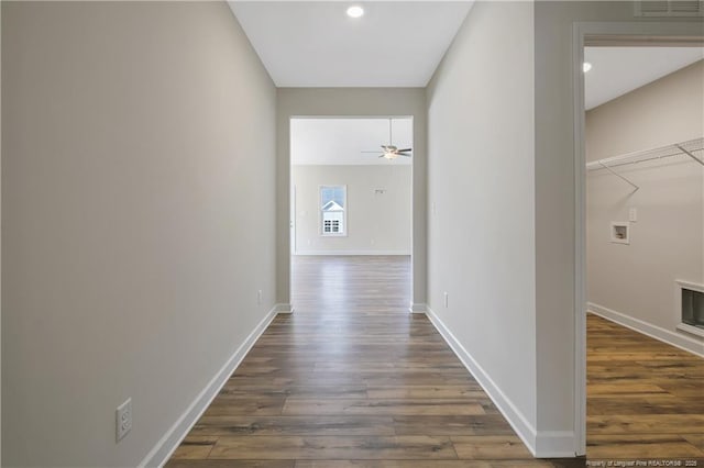 5411 Seedling Rd, Fayetteville, NC 28311 - hallway featuring dark wood finished floors, baseboards, and recessed lighting