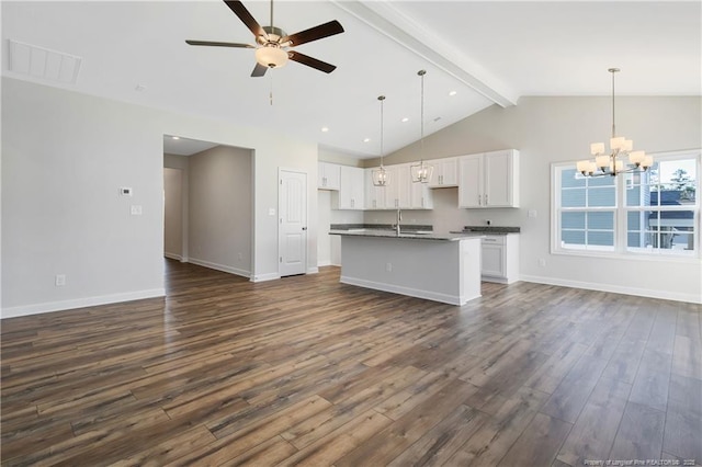 5411 Seedling Rd, Fayetteville, NC 28311 - kitchen with open floor plan, dark countertops, beam ceiling, a chandelier, and high vaulted ceiling
