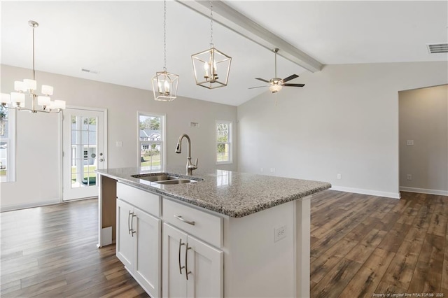 5411 Seedling Rd, Fayetteville, NC 28311 - kitchen featuring a chandelier, a sink, open floor plan, and dark wood-type flooring