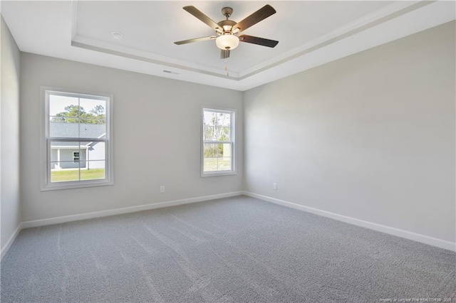 5411 Seedling Rd, Fayetteville, NC 28311 - empty room with a raised ceiling, baseboards, healthy amount of natural light, and a ceiling fan