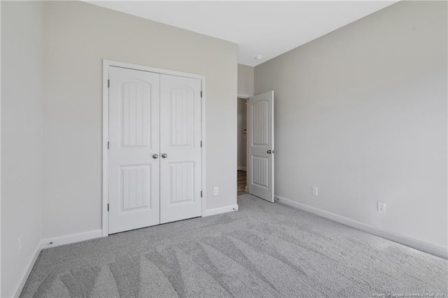5411 Seedling Rd, Fayetteville, NC 28311 - unfurnished bedroom featuring carpet flooring, baseboards, and a closet
