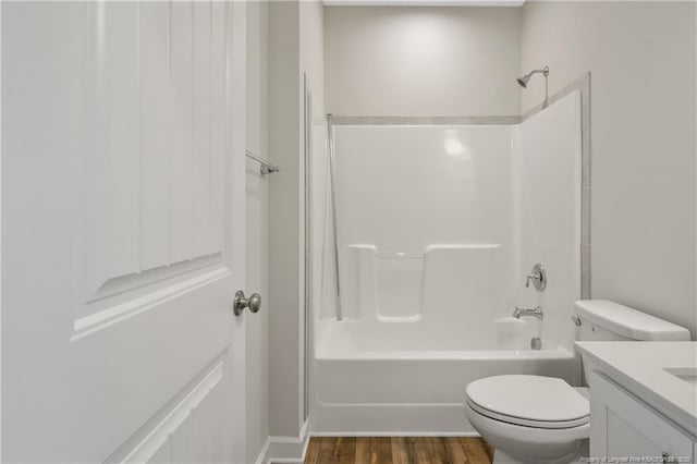 5411 Seedling Rd, Fayetteville, NC 28311 - full bath featuring vanity, toilet, shower / tub combination, and wood finished floors