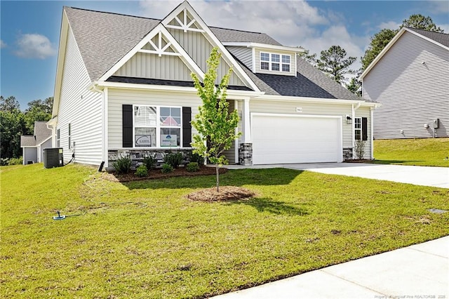 5411 Seedling Rd, Fayetteville, NC 28311 - craftsman-style house featuring concrete driveway, a garage, board and batten siding, and a front lawn