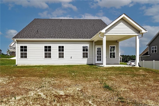 5411 Seedling Rd, Fayetteville, NC 28311 - rear view of property featuring a shingled roof and a patio