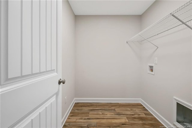 5411 Seedling Rd, Fayetteville, NC 28311 - laundry room with washer hookup, wood finished floors, and baseboards