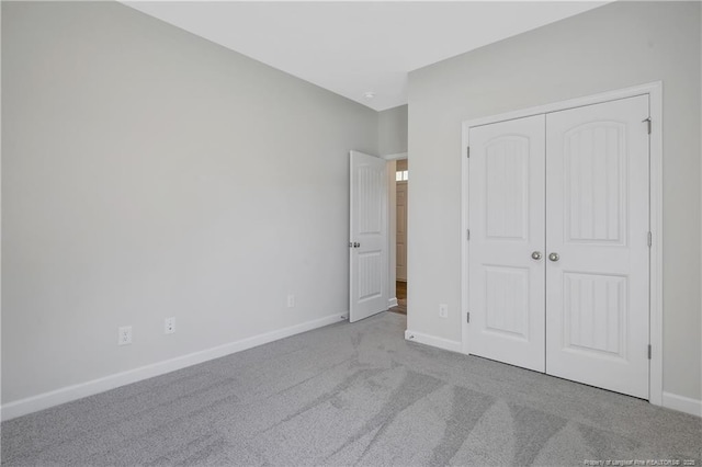 5411 Seedling Rd, Fayetteville, NC 28311 - unfurnished bedroom featuring baseboards, carpet flooring, and a closet