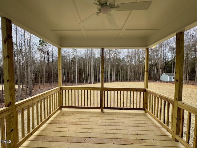 wooden terrace featuring ceiling fan