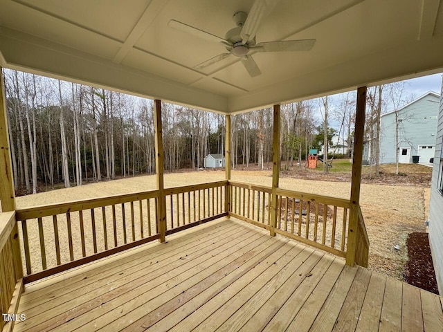 wooden deck featuring ceiling fan