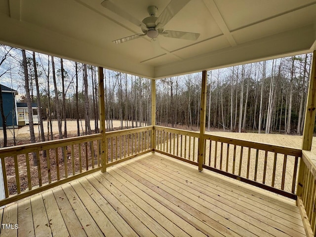 wooden deck featuring ceiling fan