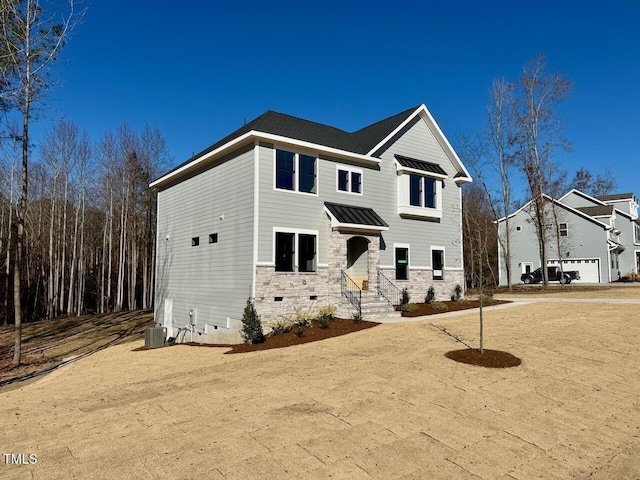 view of front of property featuring cooling unit