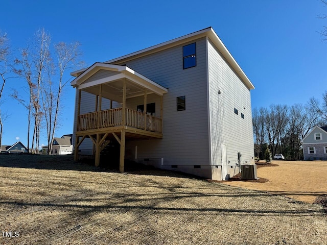 rear view of house featuring cooling unit