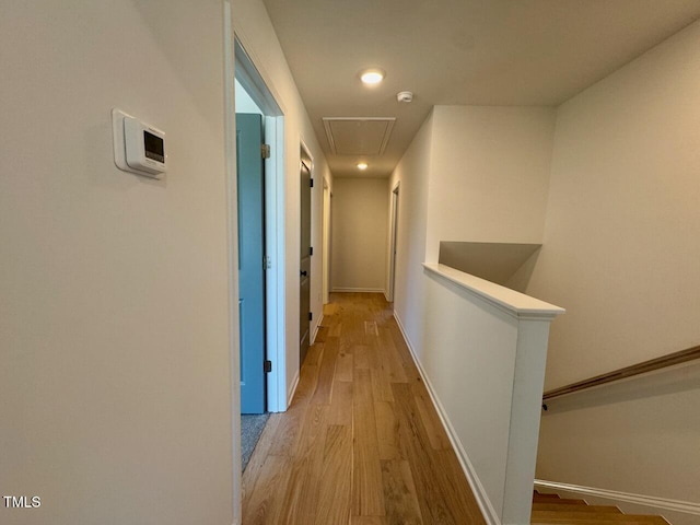 hall with light hardwood / wood-style flooring