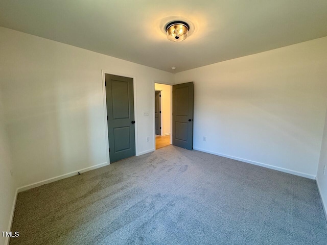 unfurnished bedroom featuring carpet