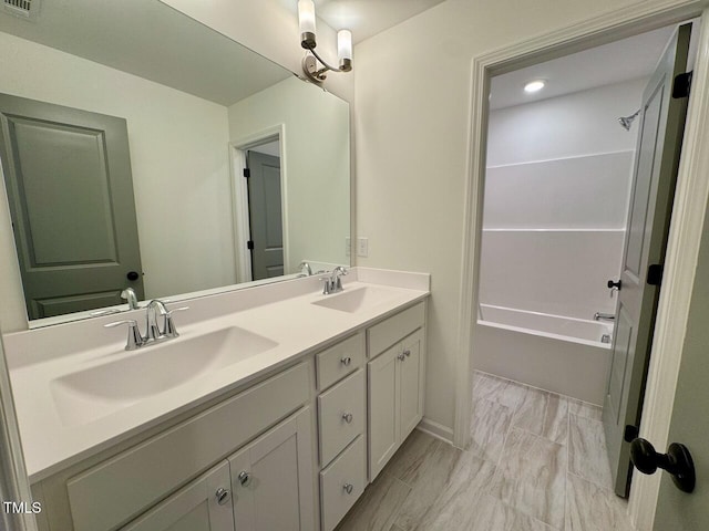 bathroom featuring vanity and shower / bath combination