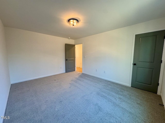 spare room featuring carpet