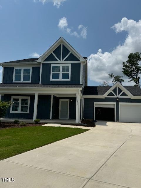 view of front of home with a garage and a front yard