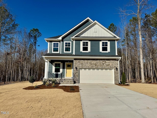 view of front of property with covered porch and a garage